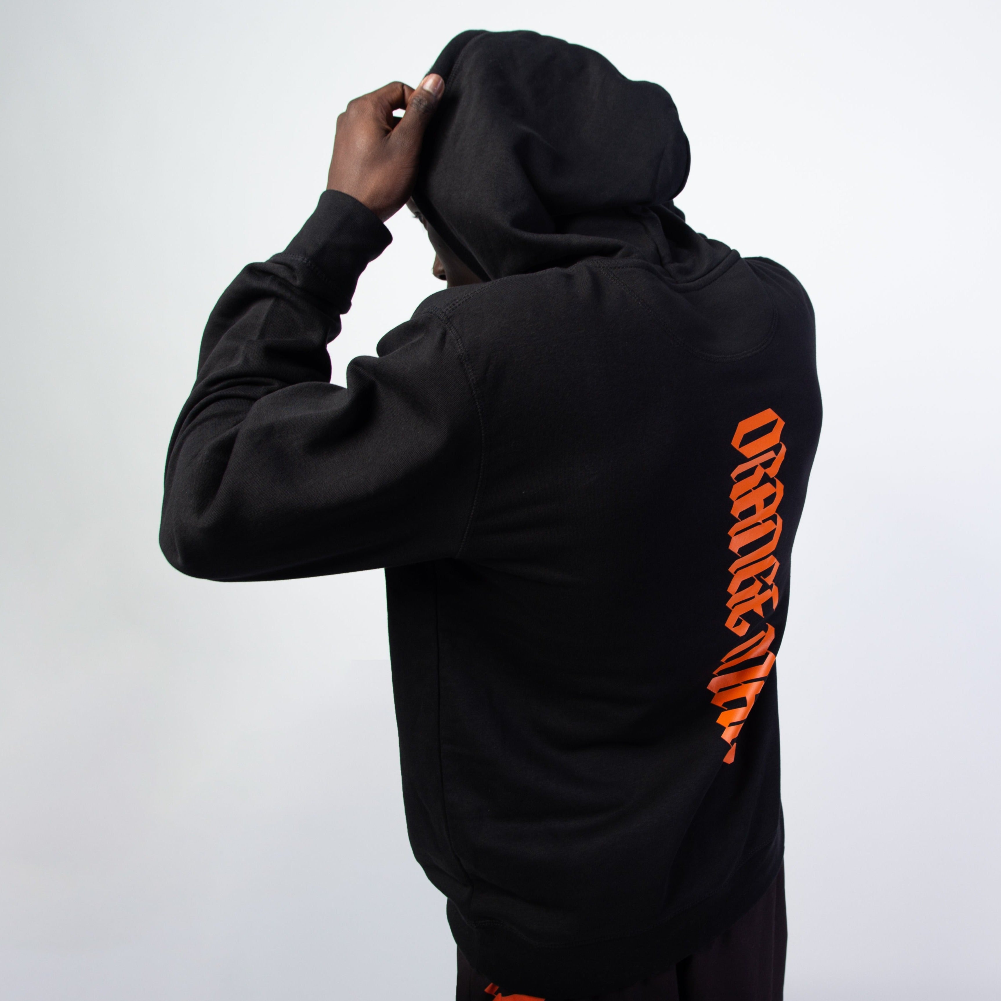 Sweat noir 2025 et orange